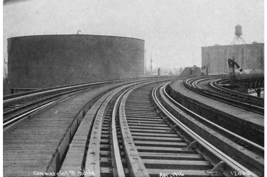 Image for molasses tank viewed from elevated railroad (1916, ber photograph collection, 9800 018, boston city archives)