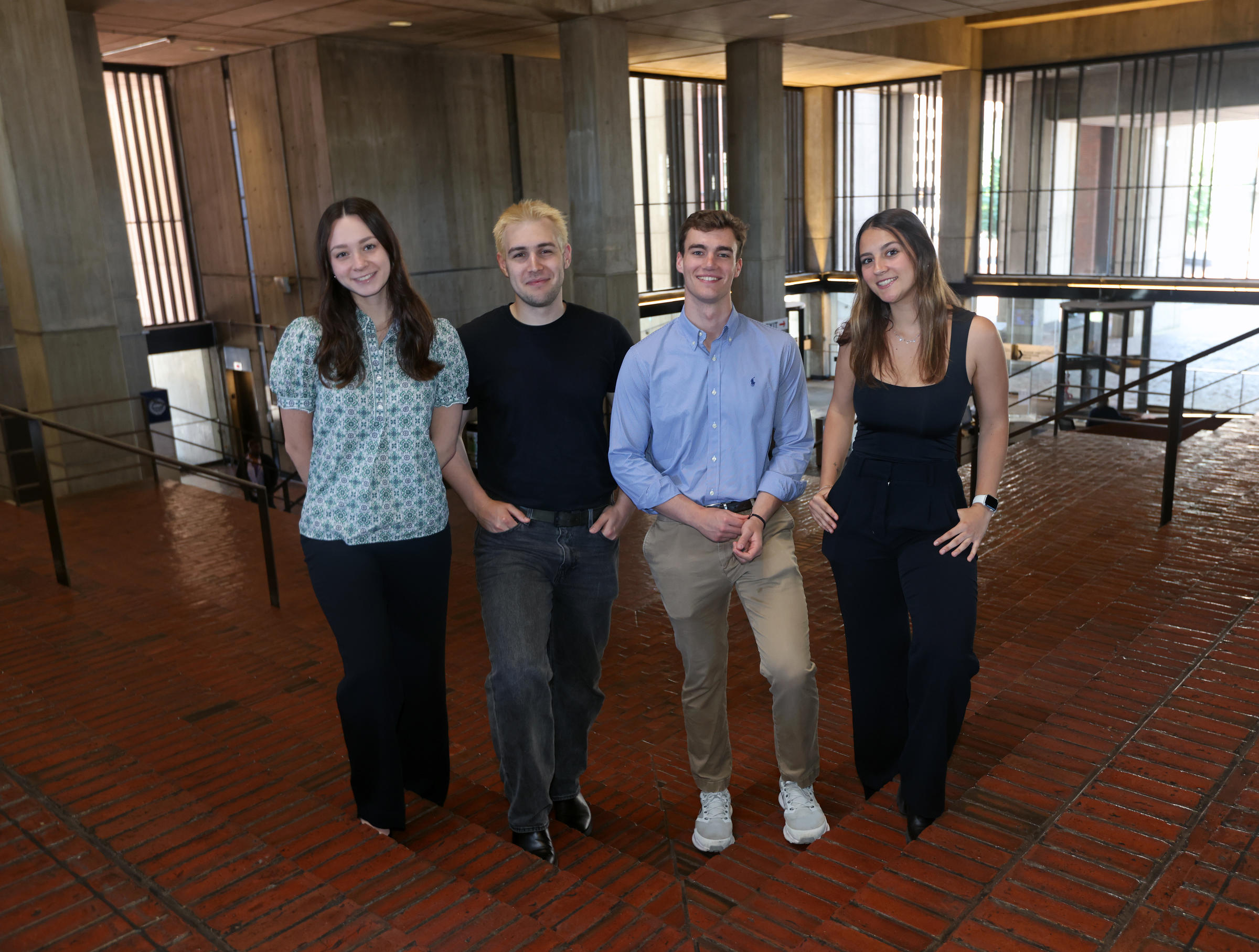 Photo of four Northeastern University Co-ops in City Hall 