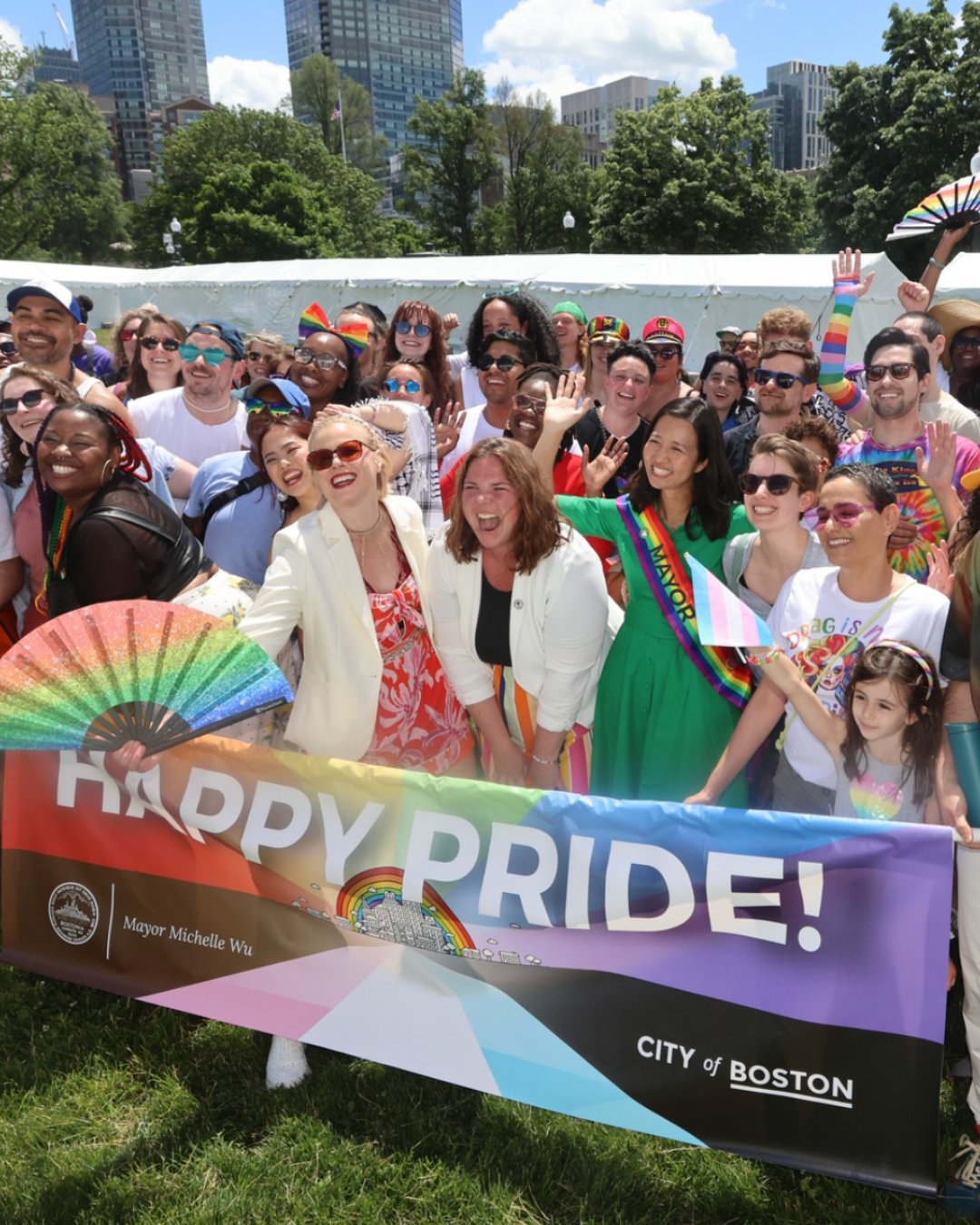 image of group of people posing during pride parade