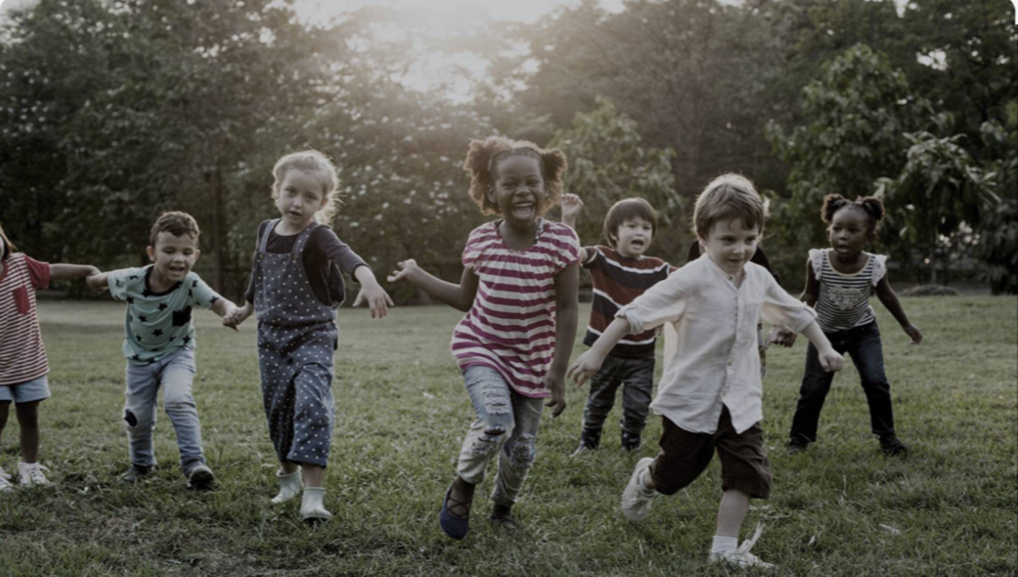 Children running together in a field