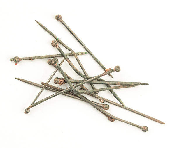 Close-up of a small collection of the 18th-century straight pins found during excavations of Faneuil Hall.