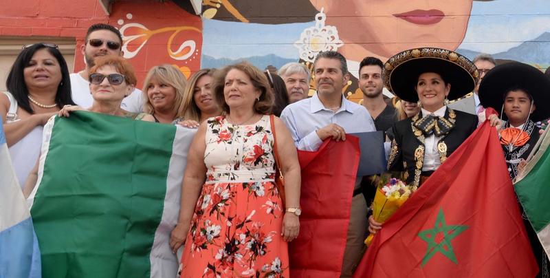 People holding flags representing different countries