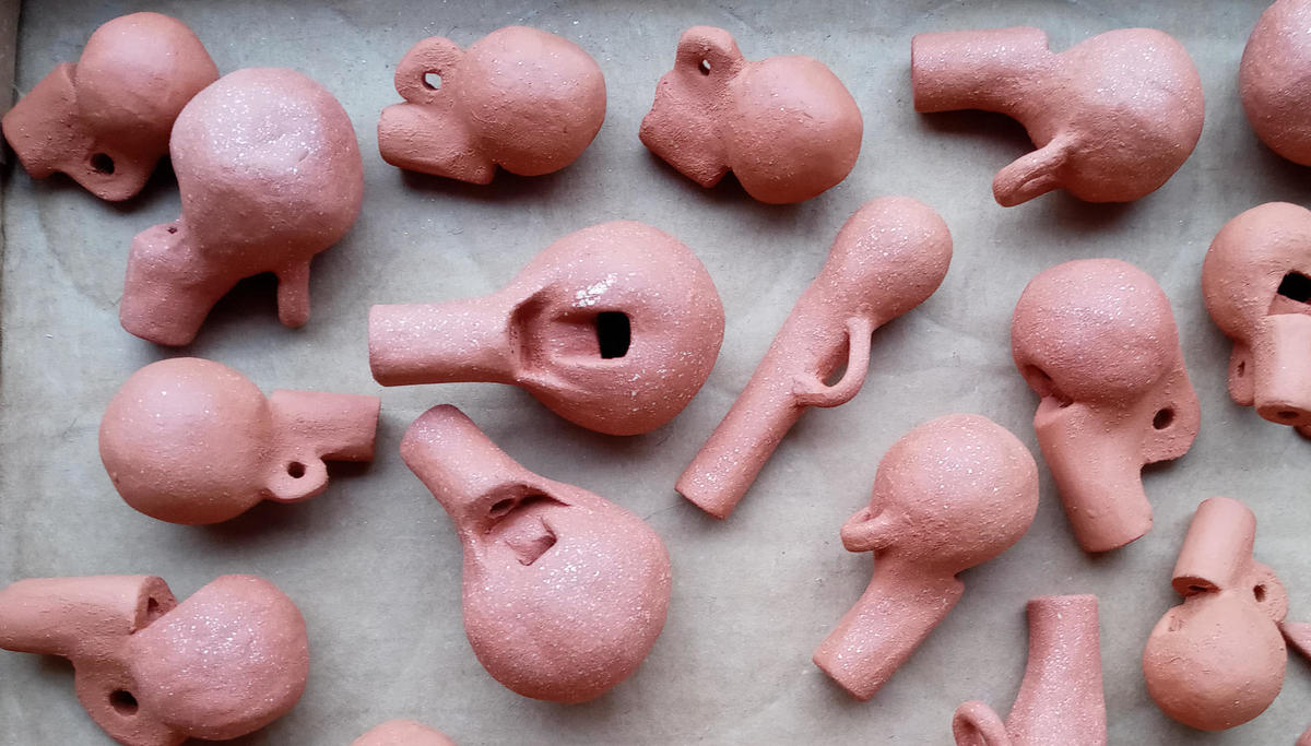Clay whistles handmade by Erin Genia