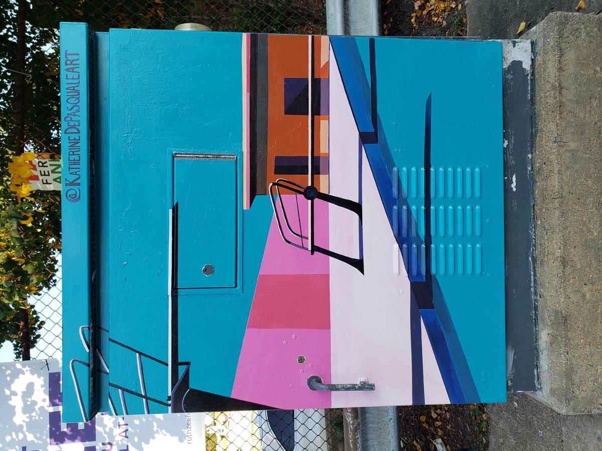 Painted utility box with design of a pool and diving boards