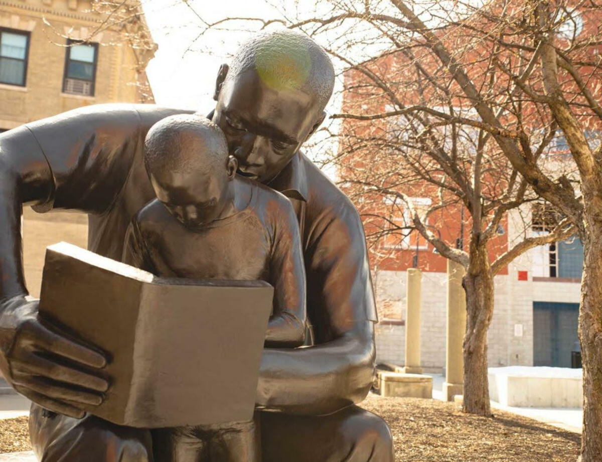 Image of sculpture "Father And Son Reading" by artist John W. Wilson 