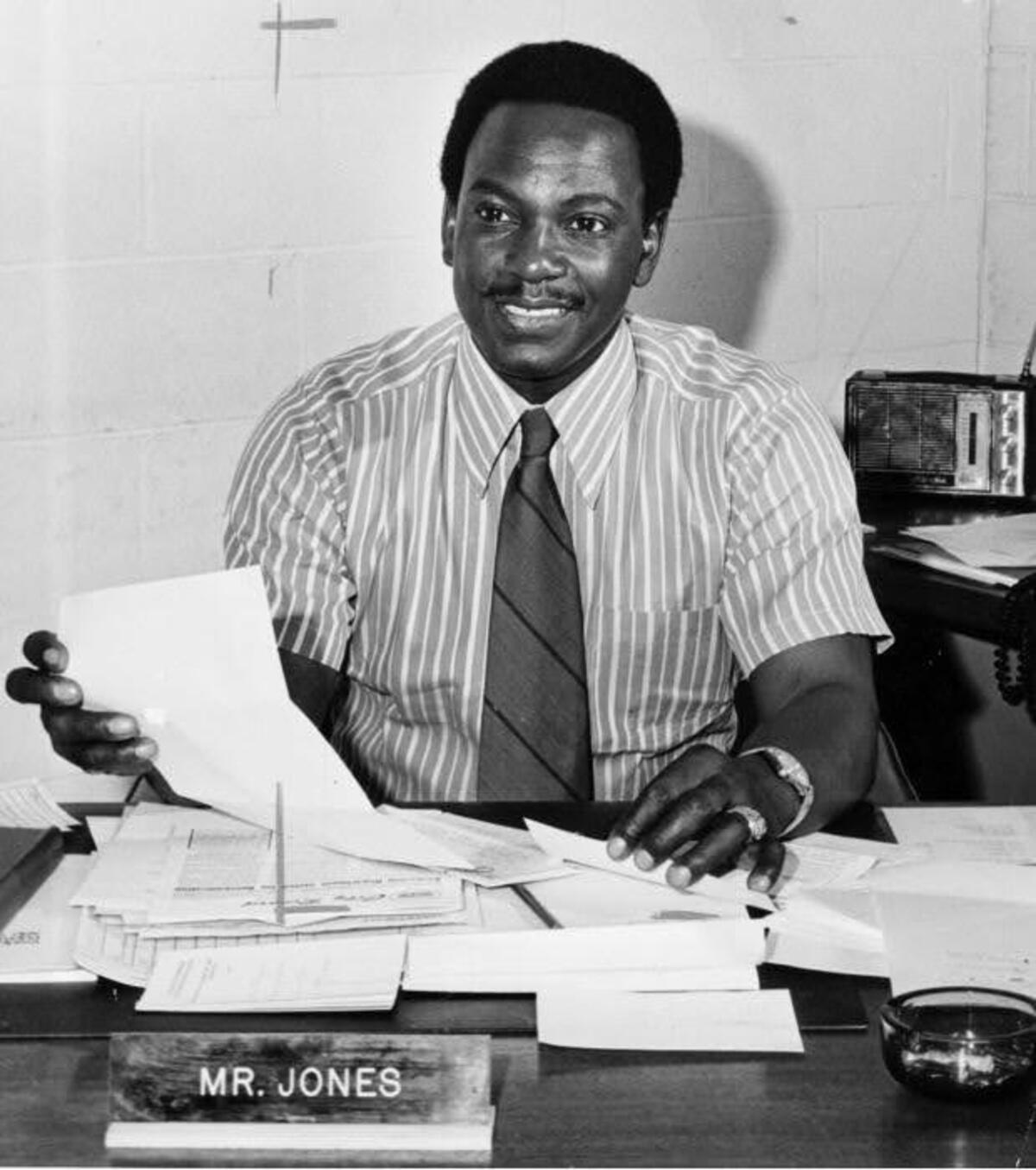 Clarence Jones is pictured at a desk