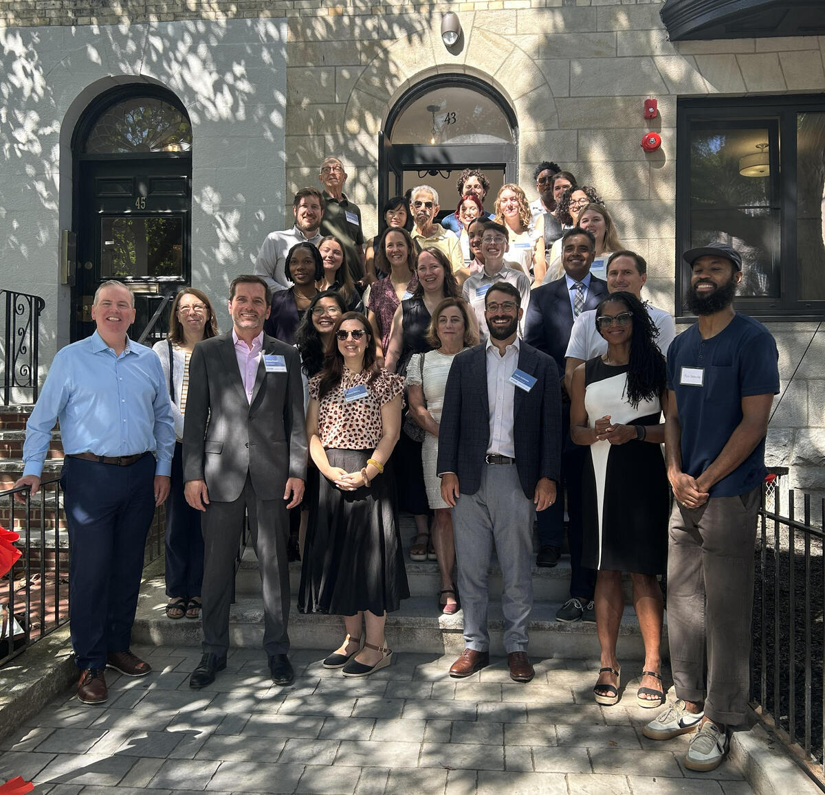 A group of Bostonians celebrate the grand opening of 43 43 Hemenway Street, six renovated affordable new homes in the Fenway