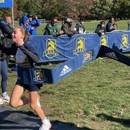 Cross Country athlete crosses the finish line