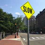 Yellow Slow Sign on Street