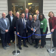Chief of Housing Sheila Dillon cuts the ribbon on Logan Square Residence's opening day