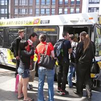 Image for people getting on mbta bus 57