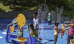Children play on the splash pad at Mother's Rest Park
